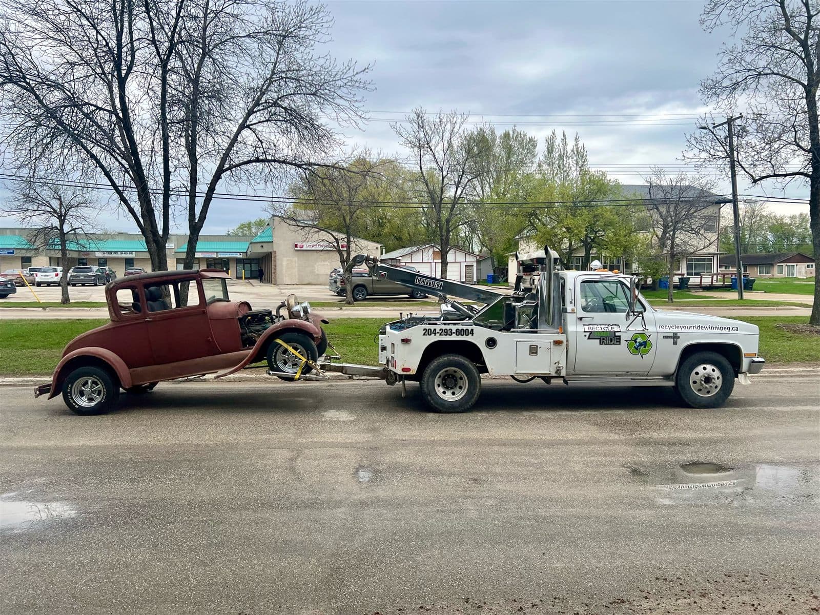 Recycle Your Ride tow truck picking up a classic vehicle in Winnipeg